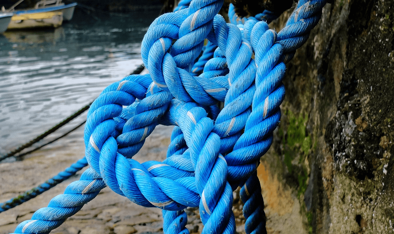 Blue nylon rope knotted and used as an anchor rope