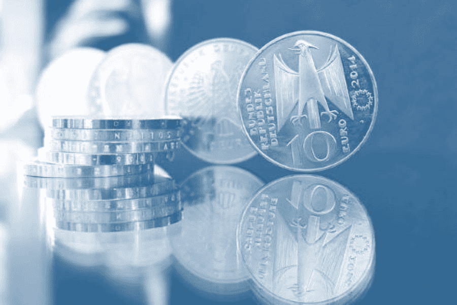 Paracord manufacturing: German coins on reflective surface