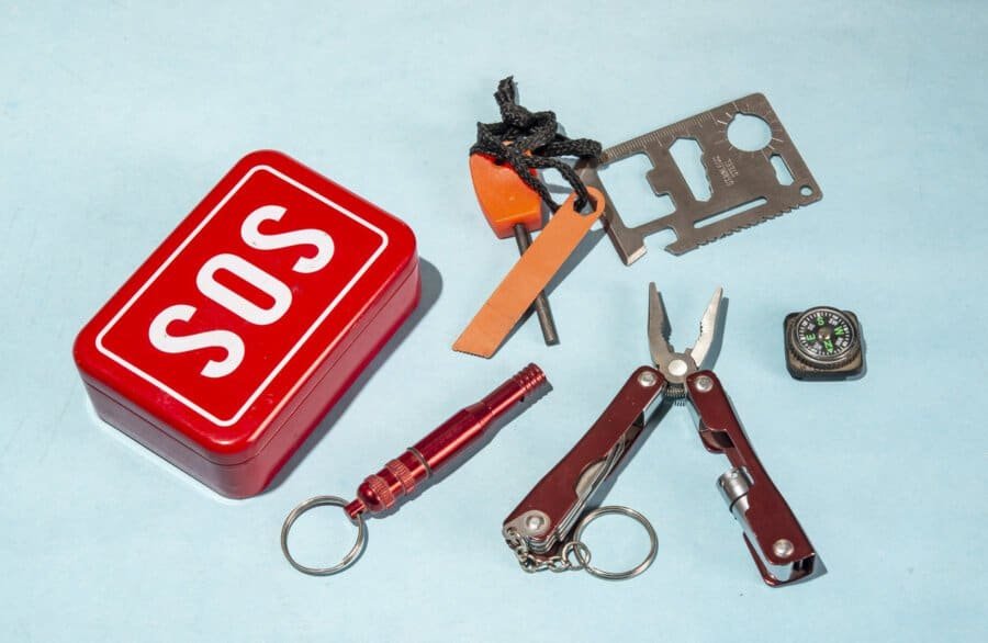 Top 10 Survival Card Suppliers in the UK: A Guide to Outdoor Survival Cards and Where to Buy Them in Bulk 13 SOS Emergency Life saving kit with tools on blue banner.