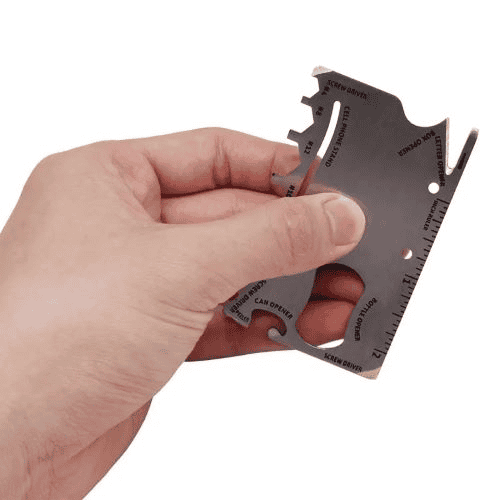 Survival card suppliers: hand holding a silver-colored survival card.