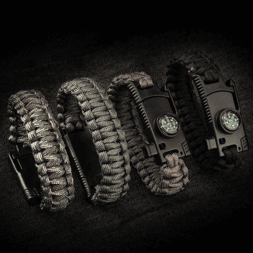 Paracord manufacturer: paracord survival bracelets in different colors on black background.