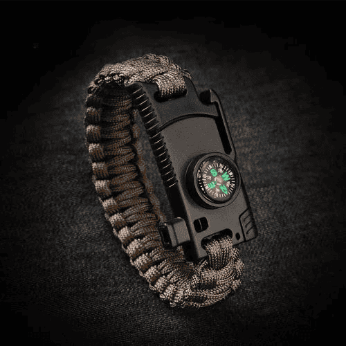 Paracord factory: brown paracord survival bracelet on black background.