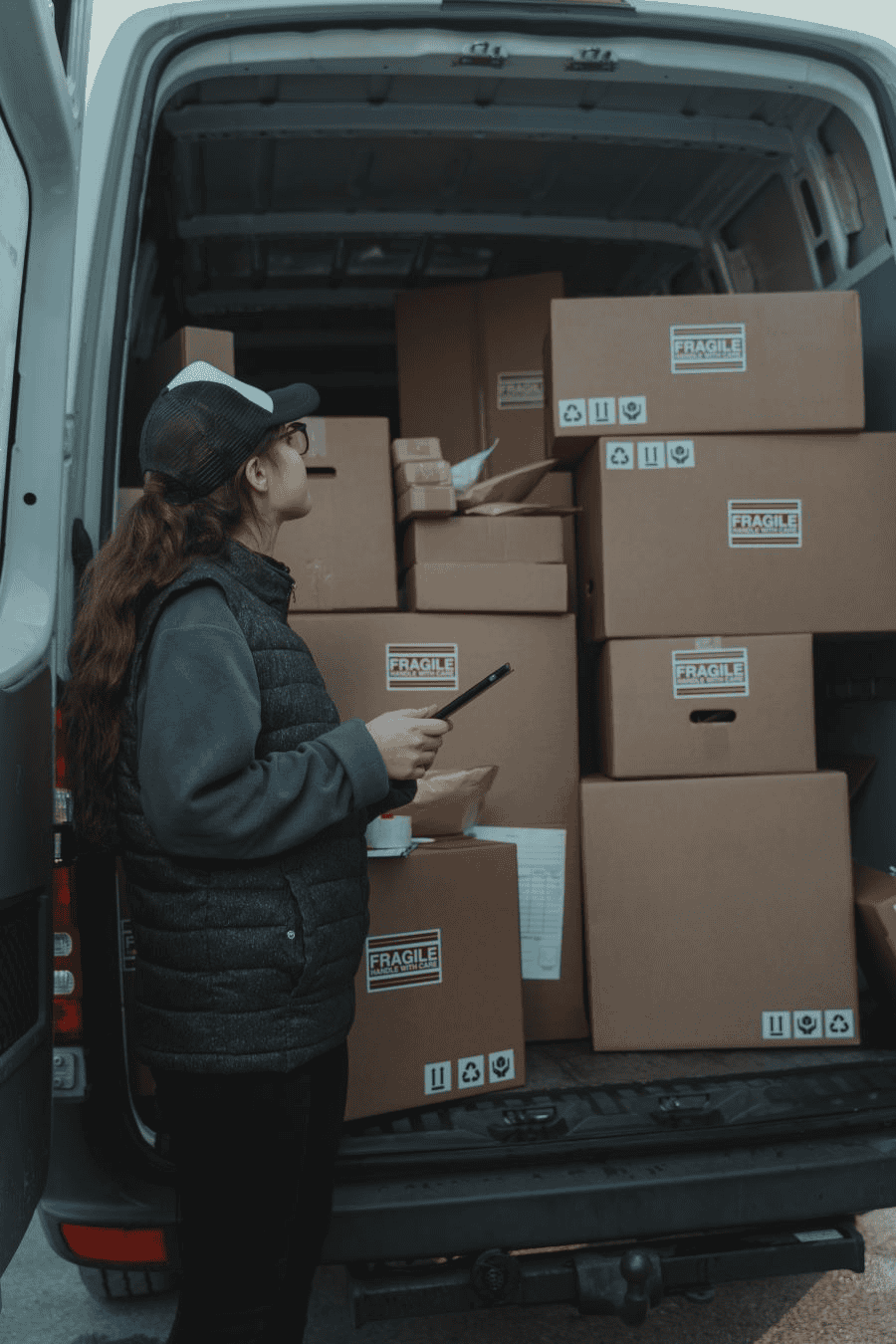 Paracord wholesale: woman checking the contents of a delivery van.