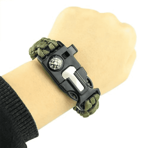 Paracord factory: woman wearing an army green paracord survival bracelet.