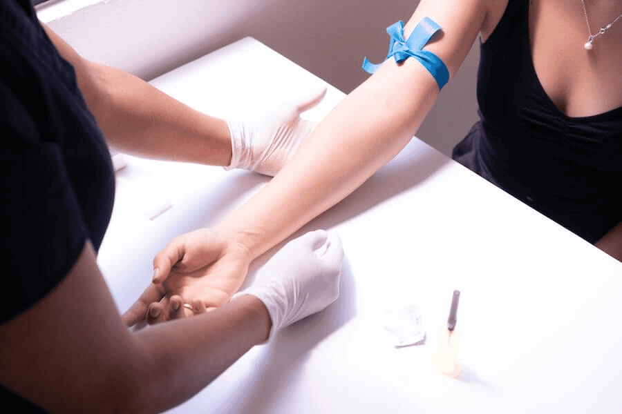Paracord manufacturing: a woman getting her blood drawn.
