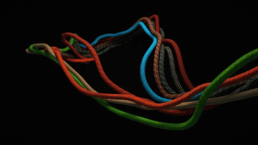 Is There a Better Rope Than Paracord? Exploring Alternatives and Paracord Manufacturer 3 Paracord factory: multi-colored rope divided into parts on a black background.