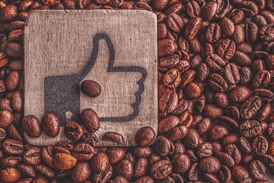 Paracord factory: wooden tile with thumbs up image on roasted coffeee beans.