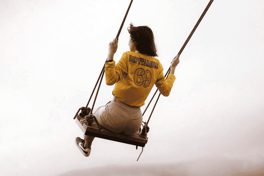 Paracord wholesale: woman swinging in a misty park.