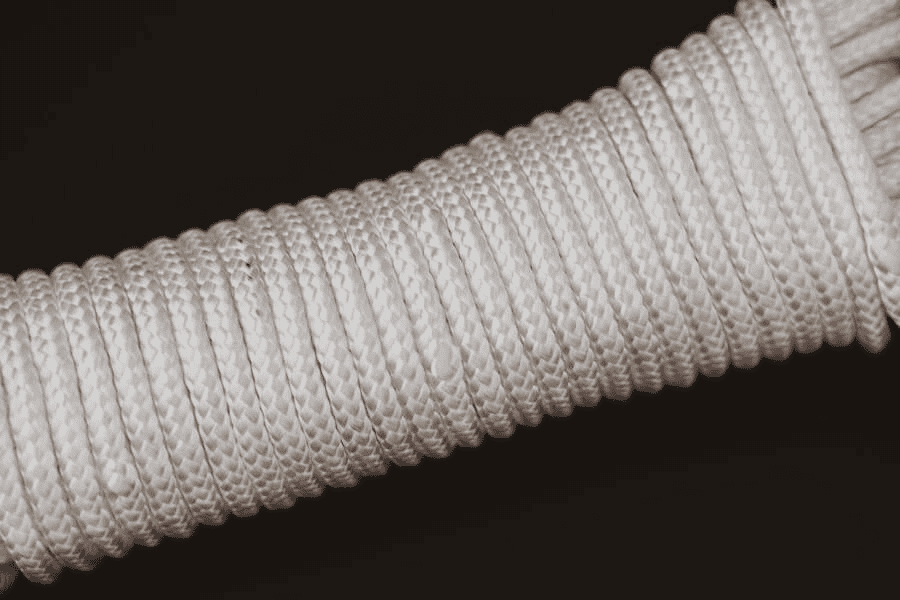 Is There a Better Rope Than Paracord? Exploring Alternatives and Paracord Manufacturer 6 Paracord wholesale: white rope on black surface.