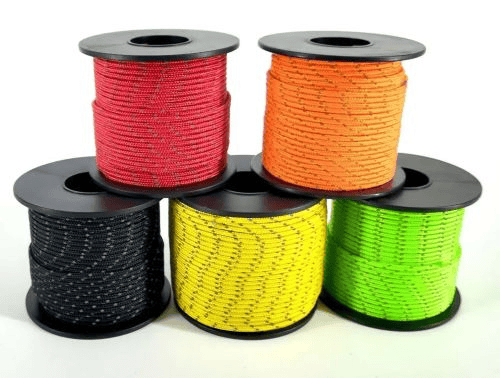 Paracord factory: a stack of paracord spools in five colors.