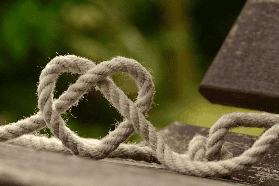 Is There a Better Rope Than Paracord? Exploring Alternatives and Paracord Manufacturer 1 Paracord manufacturing: brown rope tangled and formed into heart shape.