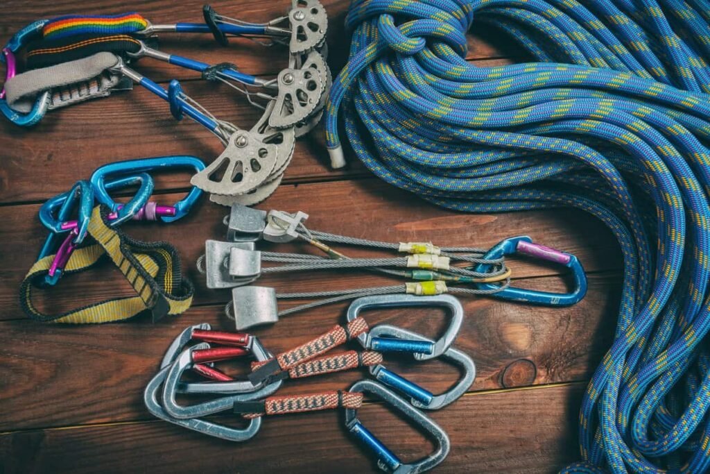Paracord manufacturing: climbing equipment on a sheet or red rock.