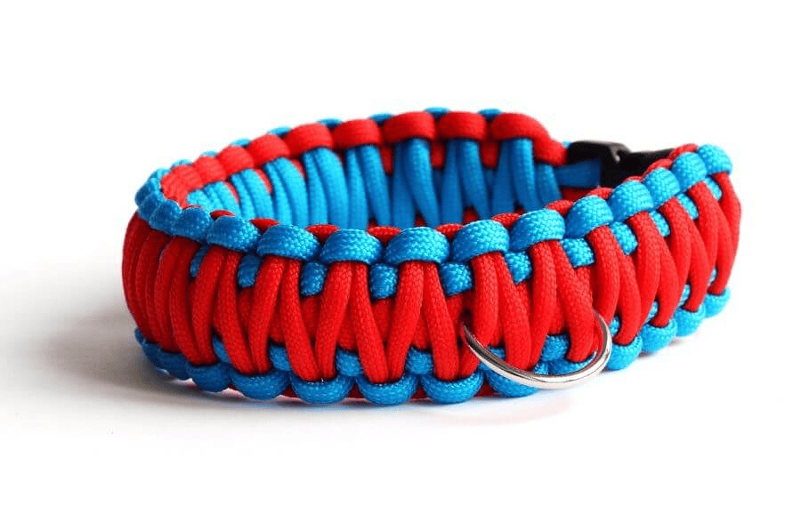 Paracord wholesale: a two-colored, woven paracord dog collar on a white surface.