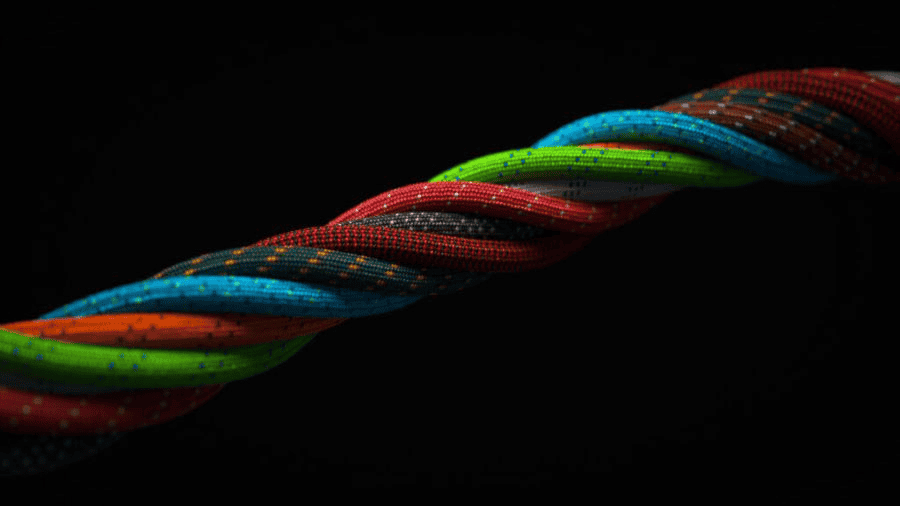 Paracord manufacturer: Multicolored paracord twisted together on a black background.