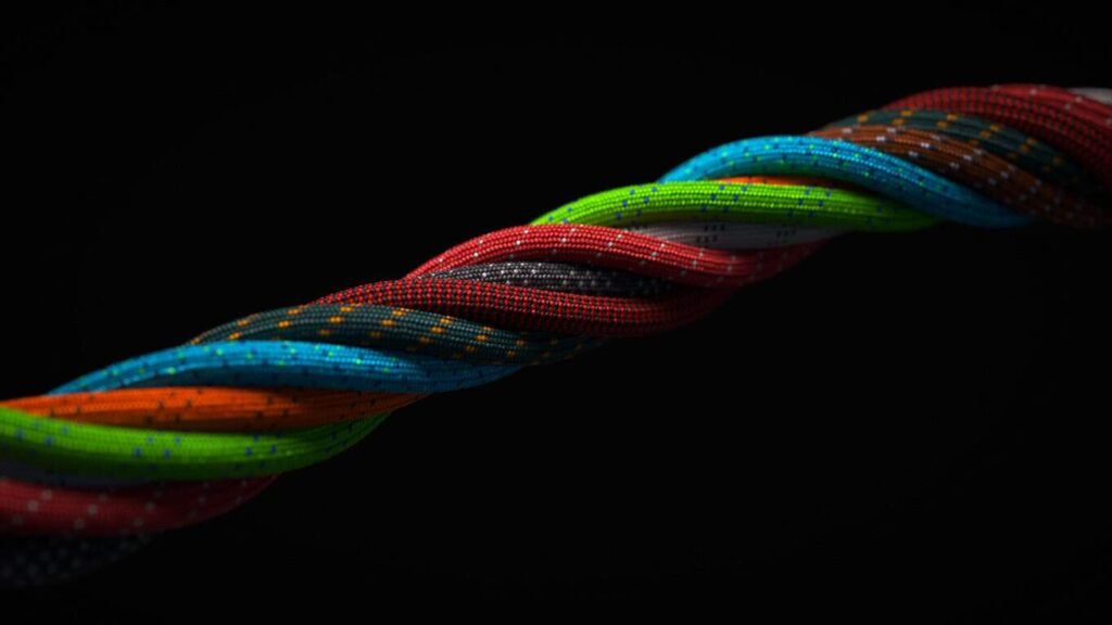 Paracord factory: Multi-colored cords on a black background.